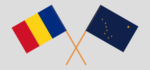 Crossed flags of Romania and the State of Alaska. Official colors. Correct proportion