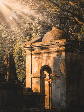 Cemetery sculpture in sunrays