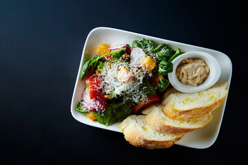 Baguette bread and vegetable salad and cheese