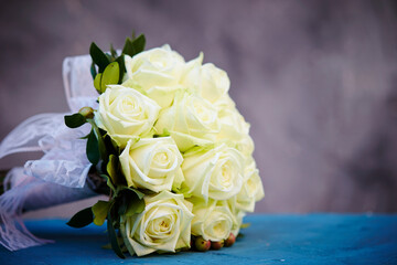 Wedding bouquet of roses on a vintage background 
