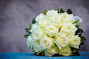 Wedding bouquet of roses on a vintage background 