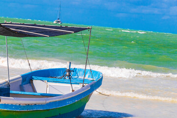 Fototapeta premium Beautiful Holbox island beach colorful old boat turquoise water Mexico.