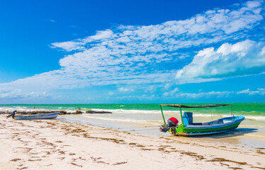 Beautiful Holbox island beach colorful old boat turquoise water Mexico.