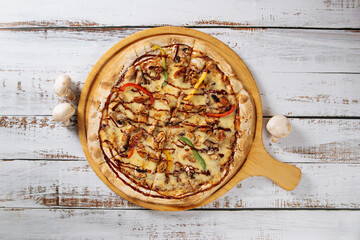 Italian bbq chicken pizza with onion, tomato, mushroom, and special sauce. Delicious Italian food for lunch or dinner.
