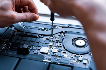 Computer fixing. Maintenance repair engineer support. Pc technician service with laptop on hardware technology background. Engineer fixing broken computer motherboard.
