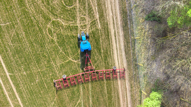 Blue Tractor In The Field, Agricultural Machinery At Work, Field From Above