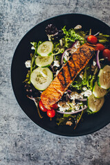 Fresh salmon salad with mixed greens