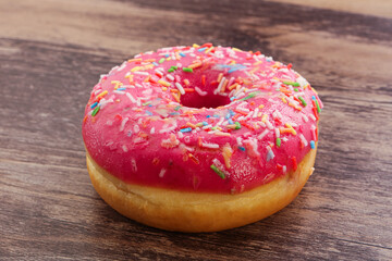 Sweet glazed struwberry donut with icing