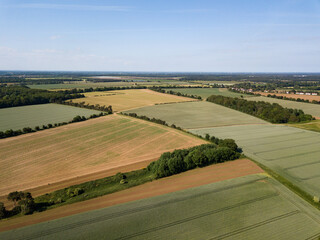 Aerial view of a patchwork of farm fields in the Suffolk countryside