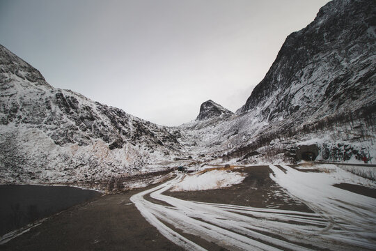View of a series of tunnels and the snow-covered Prestan hill in northern Norway. Scandinavian tundra. Landscape beyond the Arctic Circle