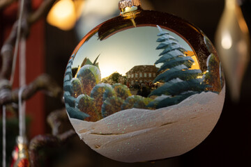 Slow travel Denmark: Reflection in a christmas tree ball on the christmas fair in Ribe