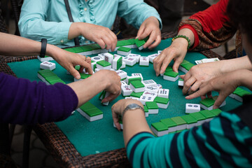 A game of mahjong being played in Bamboo Park, Chengdu, China - obrazy, fototapety, plakaty