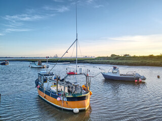 Naklejka na ściany i meble Boats moored at Stone Creek, UK at sunset