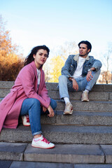 Fototapeta premium young happy students teenagers at university building on stairs, lifestyle people concept boy and girl