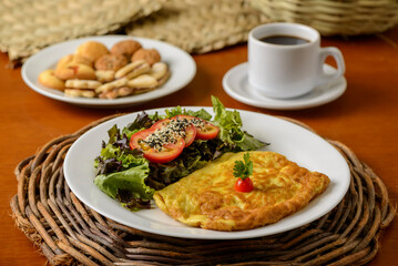 Omelet with vegetable salad served for breakfast.