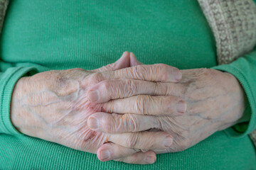 closeup wrinkled and dried hands of old person