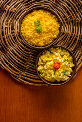 Food from the northeast of Brazil. Corn couscous with egg in clay bowl. - obrazy, fototapety, plakaty