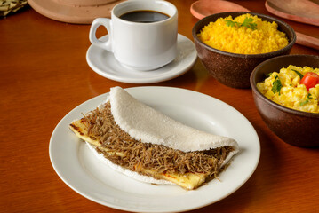 Sun meat tapioca and curd cheese, with eggs and couscous. Typical Brazilian Northeast breakfast.