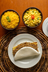 Sun meat tapioca and curd cheese, with eggs and couscous. Typical Brazilian Northeast breakfast.
