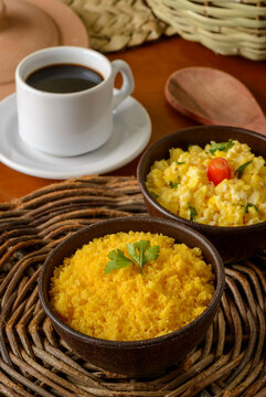 Food from the northeast of Brazil. Corn couscous with egg in clay bowl.