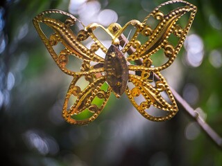 butterfly brooch on a branch