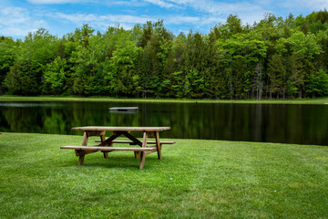 Fototapeta na wymiar picnic table on the lake