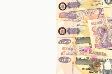Foto op Aluminium some 100 zambia kwacha bank notes with copyspace to the left on white background © Henning Marquardt