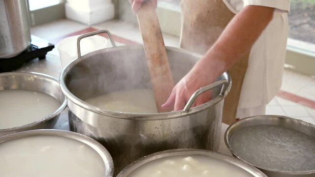 an Apulian cheesemaker prepares traditional mozzarella

