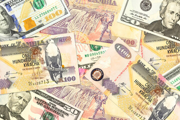 some zambia kwacha bank notes and us dollar bank notes mixed indicating bilateral economic relations
