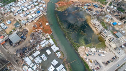 Foto op Canvas A Syrian refugee camp during a river flood in the Lebanese Bekaa Valley © Ali