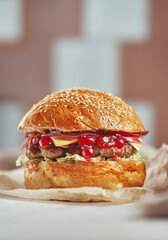 Close-up of home made tasty burgers on table.