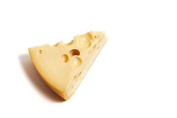 Piece of cheese with holes isolated on white background. Emmental cheese triangle, Swiss cheese