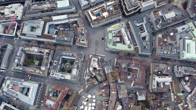 Aerial overhead drone footage of Zurich business and financial district centered around the Paradeplatz square and the old town in Switzerland largest city. 