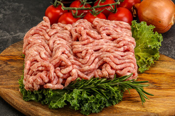 Raw pork minced meat over board