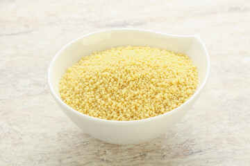 Raw couscous in the bowl