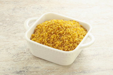 Raw bulgur in the bowl