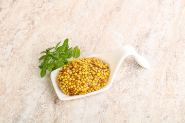 Grain mustard sauce in the bowl