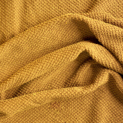 a wrinkled ocher towel
