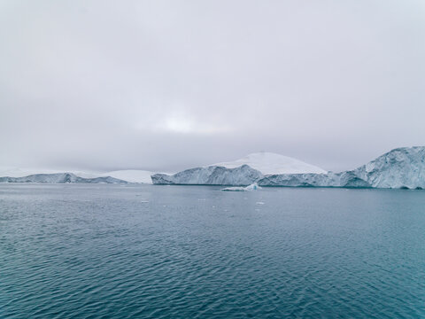 global warming in arctic ocean, icebergs are melting