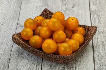Fresh yellow cherry tomato heap