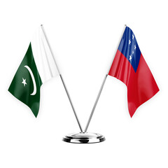 Two table flags isolated on white background 3d illustration, pakistan and samoa