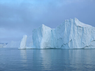 Fototapeta na wymiar Arctic Glaciers in Ilulissat Icefjord, Greenland. Climate change, unesco save to ilulissat fjords.