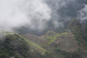 Views of Macchu PIcchu amidst the clouds in Peru