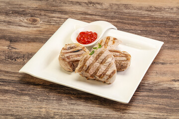 Grilled pork tenderlion with tomato sauce