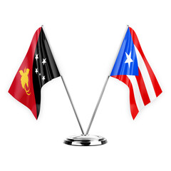 Two table flags isolated on white background 3d illustration, papua new guinea and puerto rico