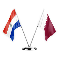 Two table flags isolated on white background 3d illustration, paraguay and qatar