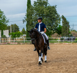 Riding a horse in competition