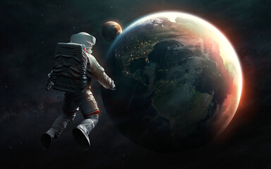 Fototapeta na wymiar Astronaut at spacewalk looks at Earth planet. Elements of image provided by Nasa