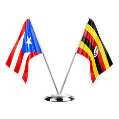 Two table flags isolated on white background 3d illustration, puerto rico and uganda