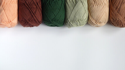Skeins of Earthy Yarn Isolated on a White Background | Yarn in a Row